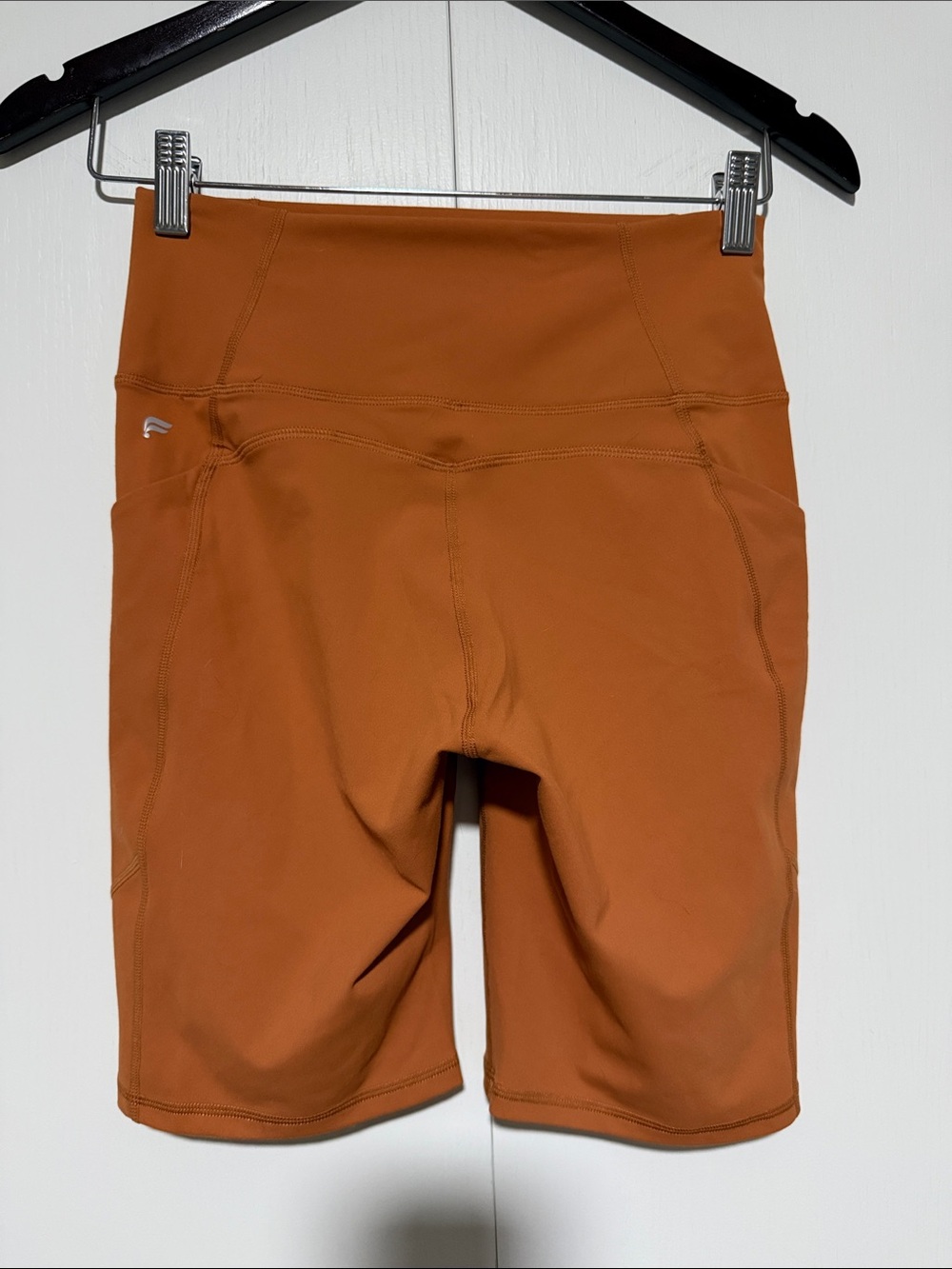 Fabletics High-Rise Bike Shorts in Rust Orange